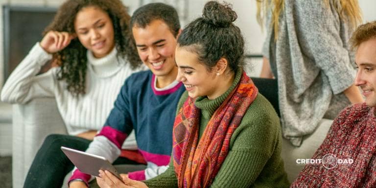 Young adults reviewing credit card statement