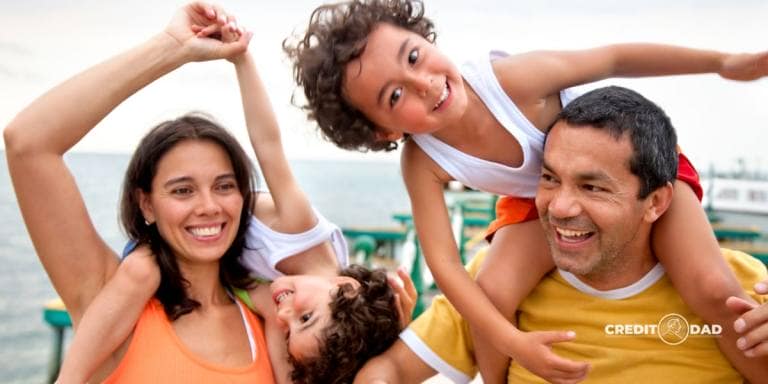 A cheerful family of four spending time outdoors, showcasing the joy of family life and smart financial planning.